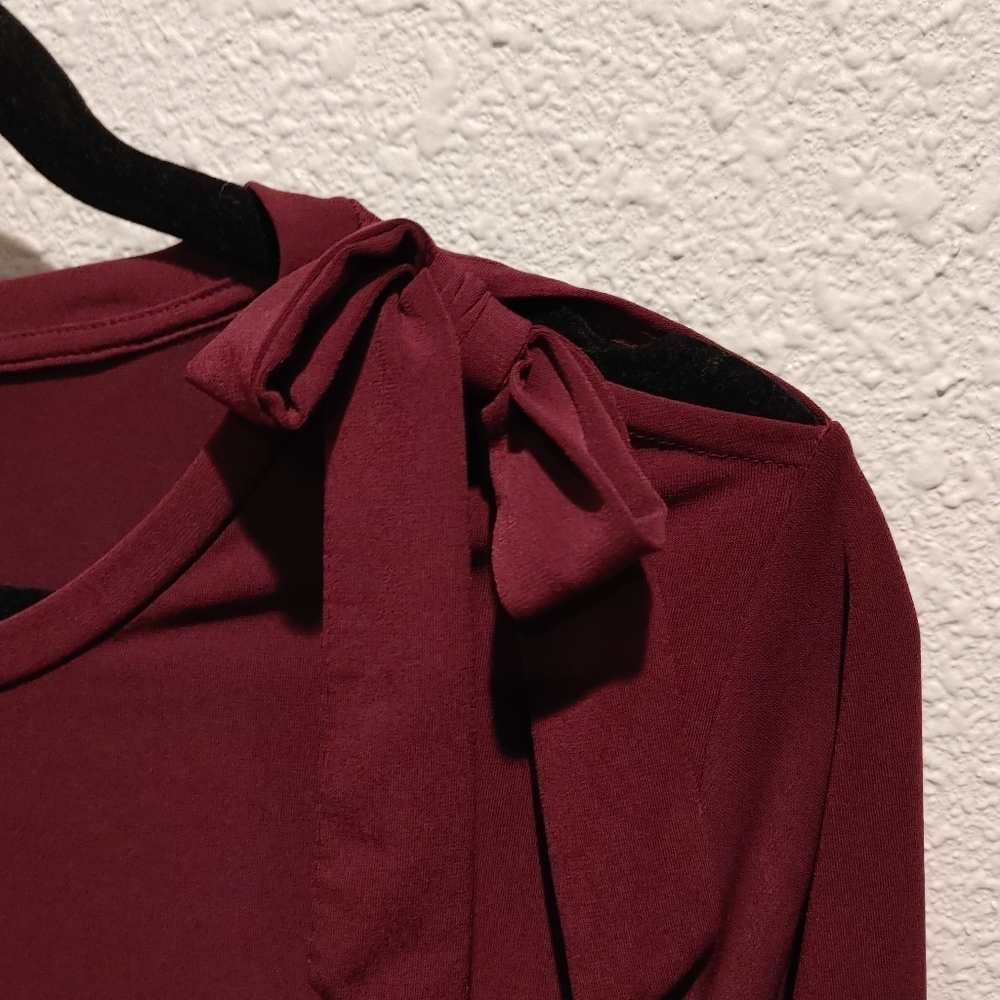Limited burgundy top with bow detail, L